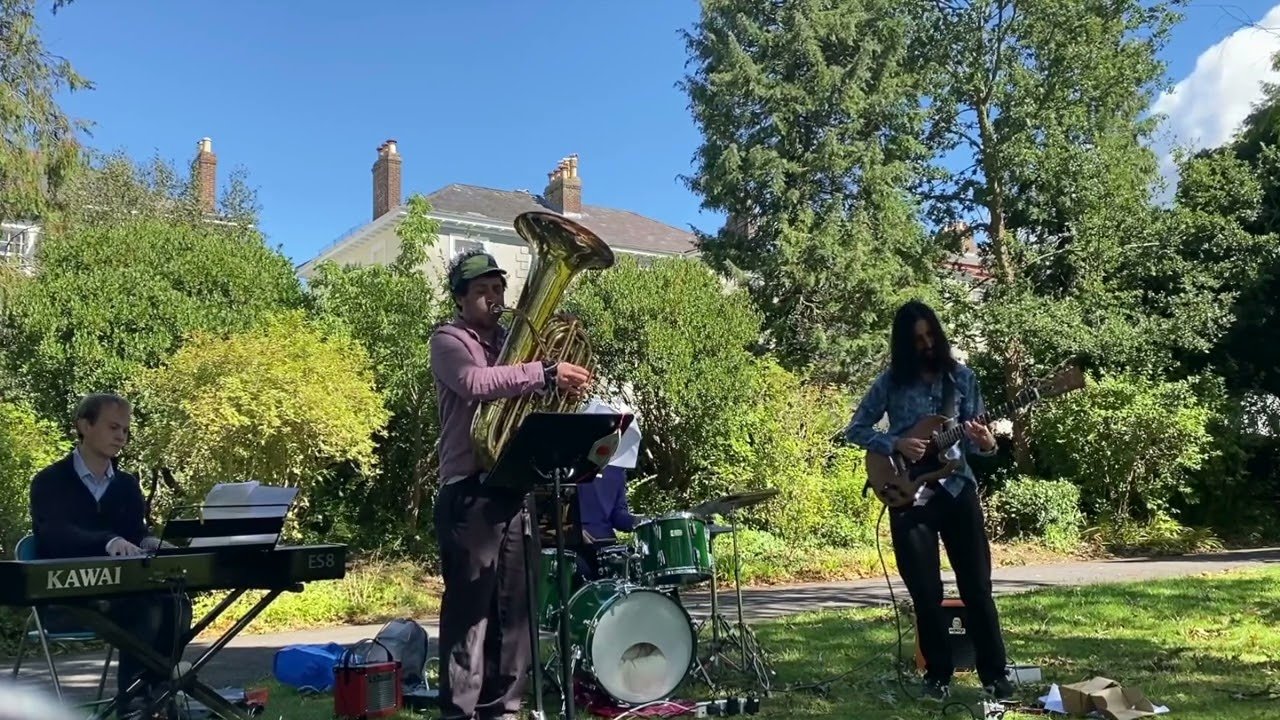 David Reinstein playing tuba outdoors with a jazz quartet in Exeter